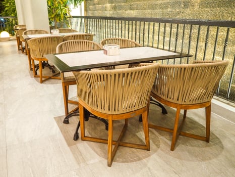 view of chairs from, wood, bamboo, rattan and tables in outdoor restaurant photo