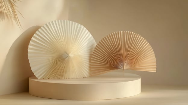 Elegant arrangement of three paper fans displayed on a round pedestal with a neutral background photo