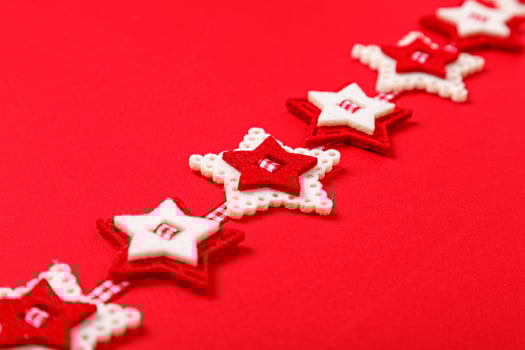 Christmas garland on a red background photo