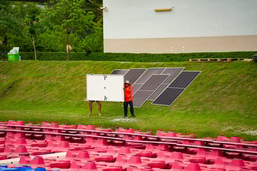 A man standing in front of a white board photo