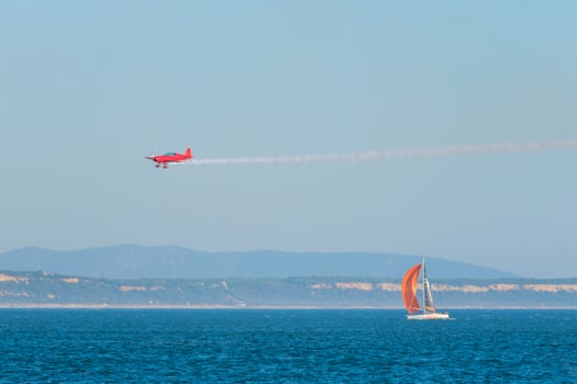 Stunt aerobatic plane performing stunts in air photo
