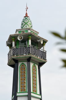 The top part of a mosque minaret photo