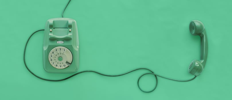 A green vintage dial telephone. photo