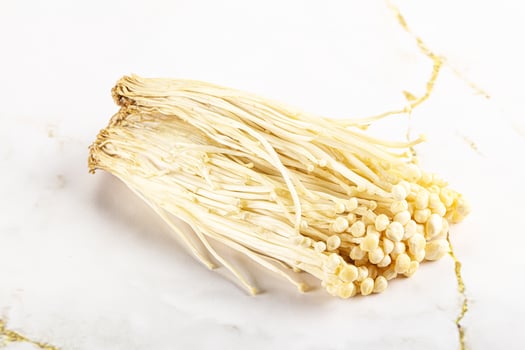 Tasty raw enoki mushroom heap photo