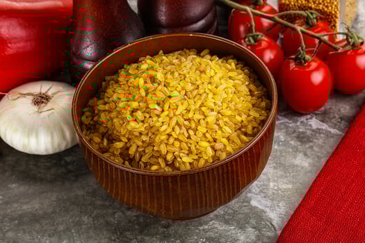 Dry wheat bulgur cereal heap photo