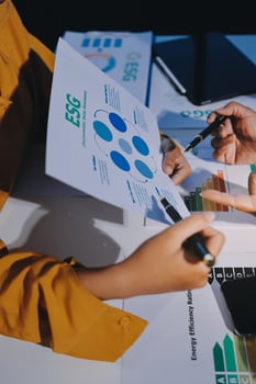 Business people working on a business plan photo