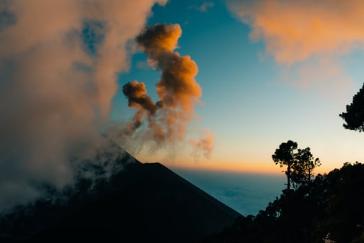 Volcano Fuego erupting at night from view of Volcano Acatenango, Guatemala photo