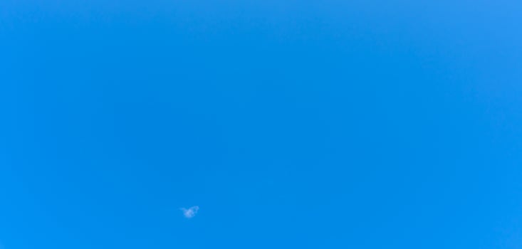 Beautiful blue sky without clouds in the morning or evening used as natural background texture in decorative art work photo