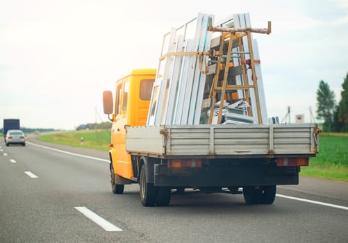 Transportation by van of pvc windows on the motorway. photo