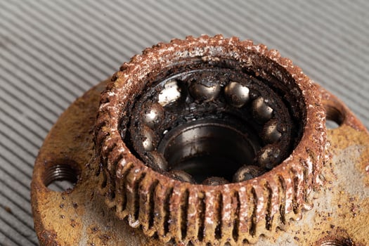 Old rusty wheel hub with a broken bearing. Bearing jamming. Automotive Part, close-up. photo