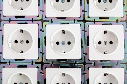 Background from home electric sockets, close-up. The concept of tariffs and prices for electricity photo
