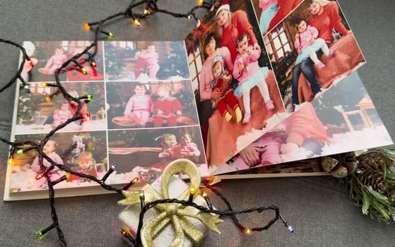 a Photobook of family. Photobook is gift. photo album next to gifts
