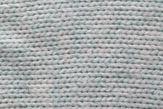 Warm gray sweater material, background, macro. Comfort photo