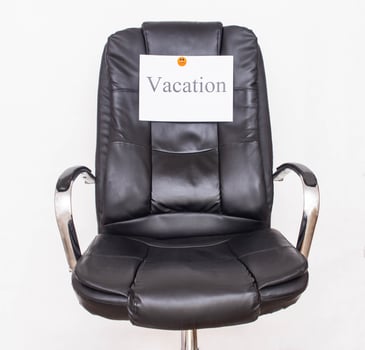 The word vacation on the office chair, the concept of leisure and vacations in the workplace, business, work photo
