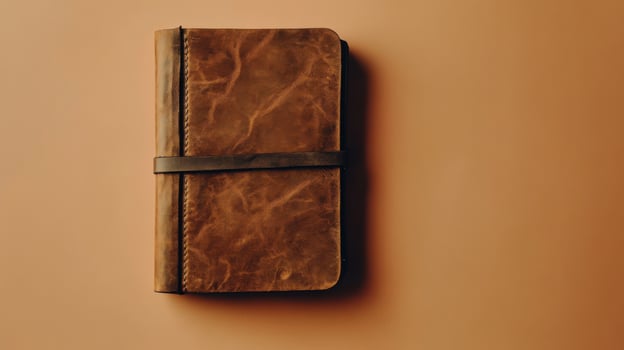 A Classic Leather Bound Journal Perfect for Note Taking and Creative Writing in Various Settings photo