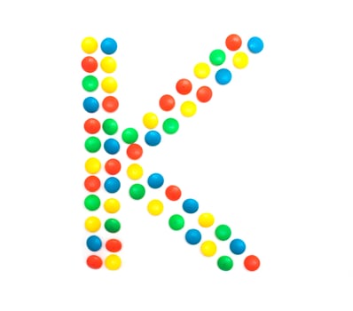 Multicolored alphabet from children's mosaic letter K photo