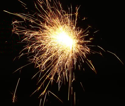 Christmas and newyear party sparkler on black photo