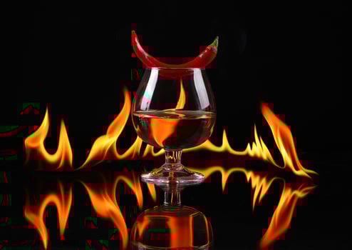 A glass of wine with a chili pepper on it photo