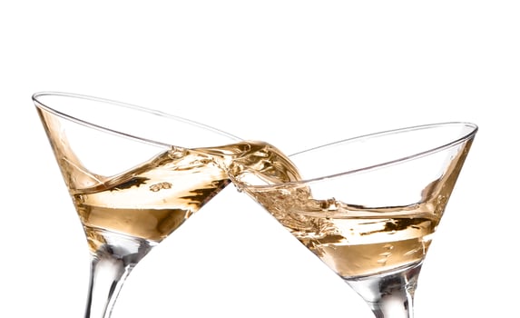 two wine swirling in a goblet martini glass, isolated on a white background photo
