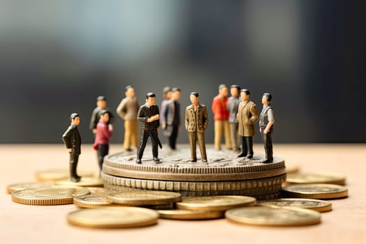 Financial power play, Miniature businessmen figurines on coins photo