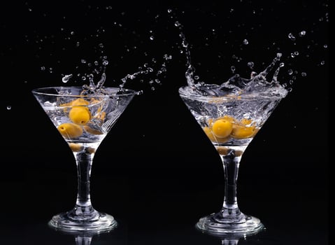 Vermouth cocktail inside martini glass over dark background photo
