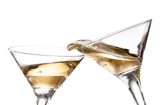 two wine swirling in a goblet martini glass, isolated on a white background photo