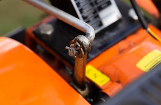 cotter pin for adjusting the gear lever in the walk-behind tractor before running in and starting work. Close-up, industry photo