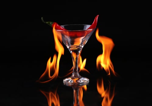 Flaming cocktail over black photo