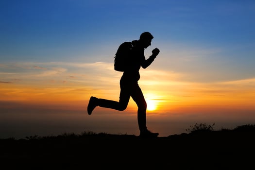 man at the top of the mountain photo