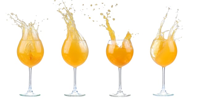 Orange cocktail with splashes. isolated photo