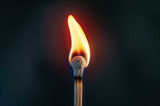 A matchstick is lit and the flame photo