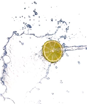 lime in spray of water. lime cucumber with splash on background photo