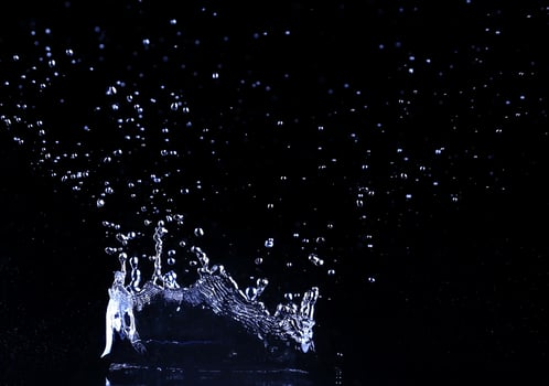 brilliant drops transparent water on black background photo