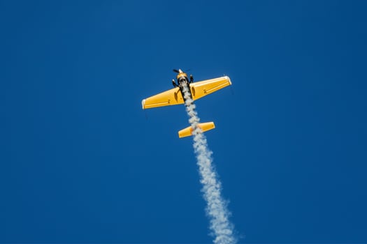 Stunt aerobatic plane performing stunts in air photo