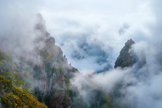 A mountain covered in fog and clouds. Madeira island, Portugal photo