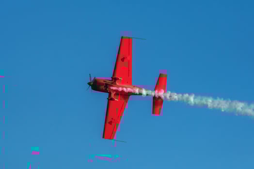 Stunt aerobatic plane performing stunts in air photo