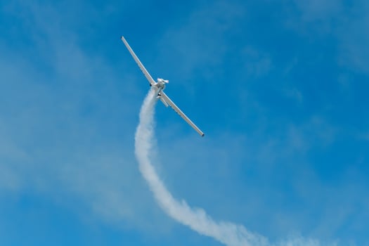 Stunt aerobatic plane performing stunts in air photo