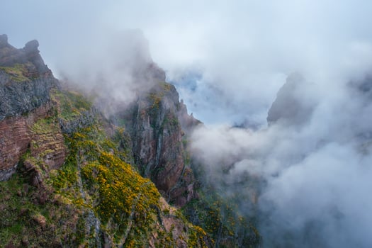 A mountain covered in fog and clouds. Madeira island, Portugal photo