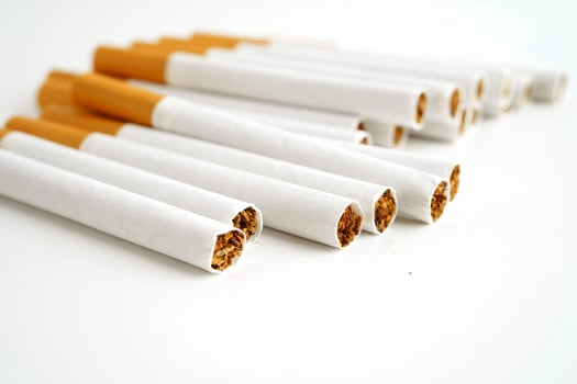 Cigarette, roll tobacco in paper with filter tube, No smoking. photo