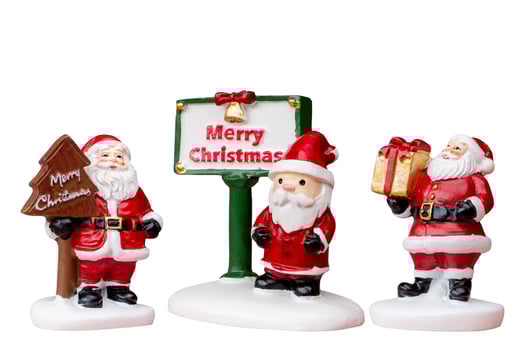 Miniature Santa Claus figurine isolated on a white background with a clipping path photo