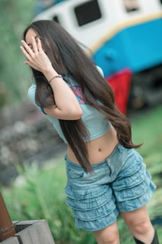 A woman with long hair and a blue shirt photo