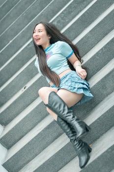 A woman sitting on some steps photo