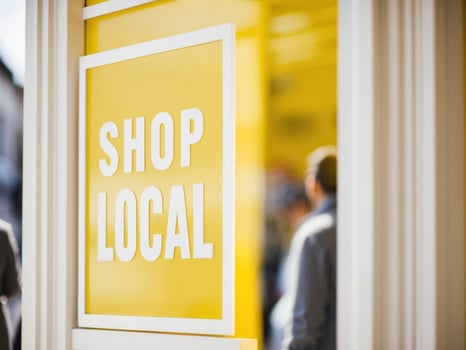 Shop local sign promoting local businesses and supporting community. photo