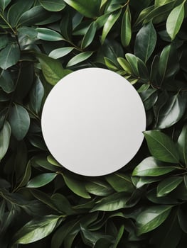 Circular blank space surrounded by fresh green leaves on a light background in a creative setting photo