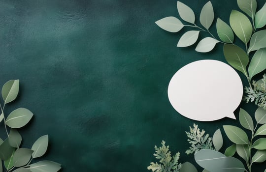 Green foliage with a blank speech bubble for creative messaging or design projects photo