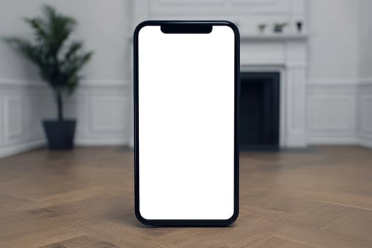 Modern smartphone with a blank screen positioned in a stylish interior setting. photo