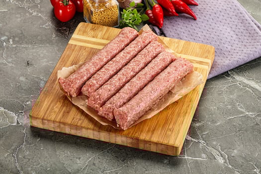 Raw beef kebab sausage for grill photo