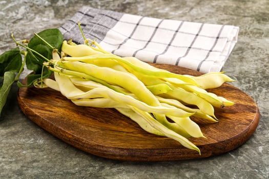 Raw green bean strings heap photo