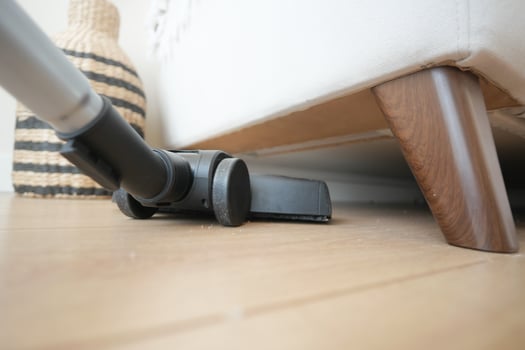 Utilizing a Vacuum Cleaner Under the Sofa for Highly Efficient and Thorough Cleaning photo