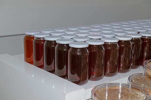 Local organic honey for sale on the market shelf in Turkey. photo